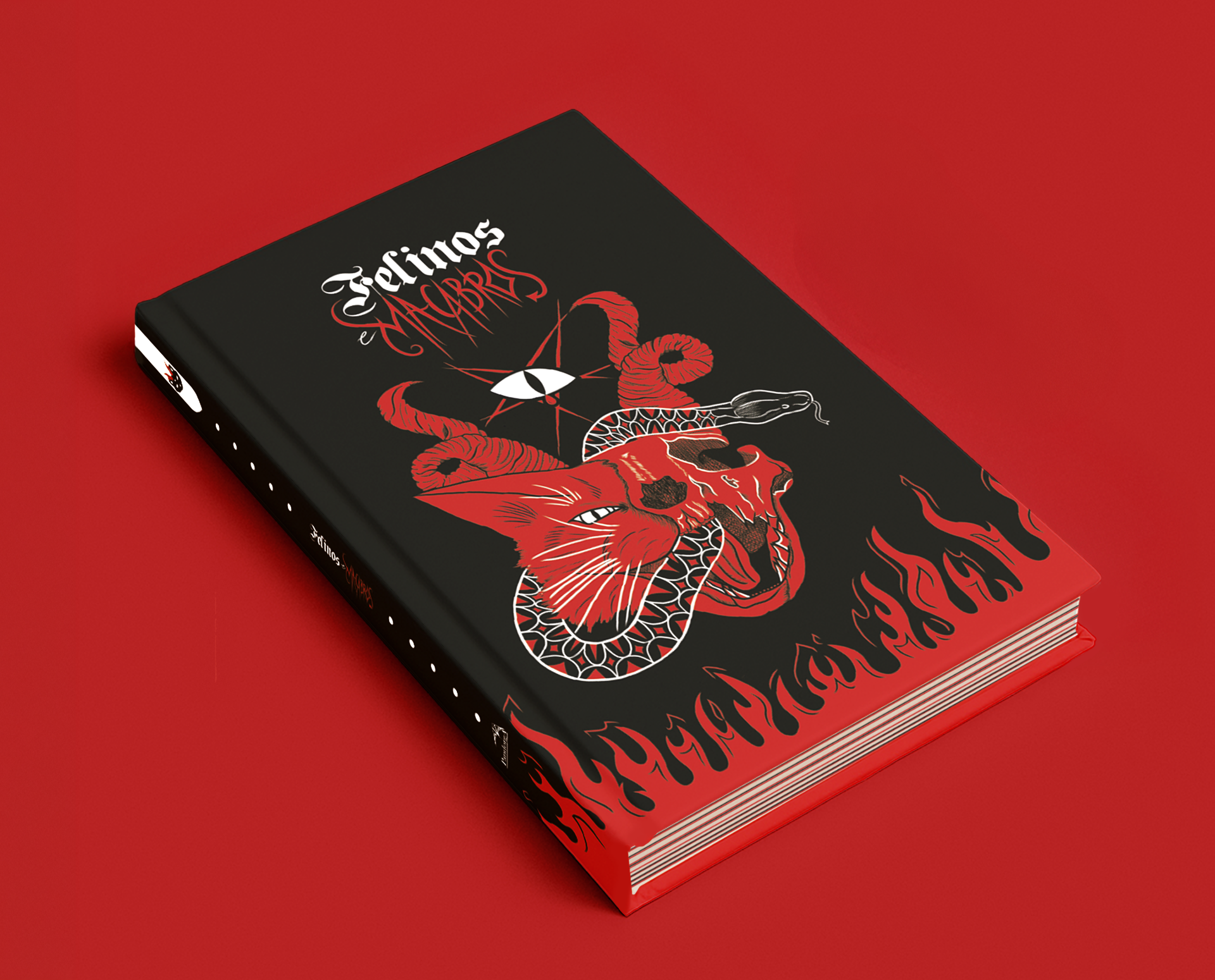 Livro Felinos deitado em perspectiva sobre fundo vermelho, com capa e lombada à mostra